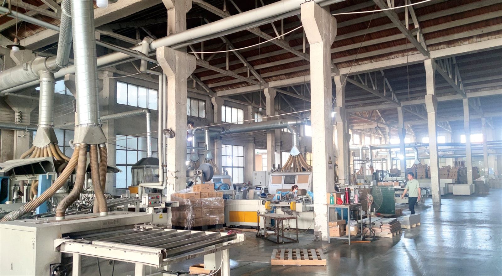 Production line for flooring and surface materials