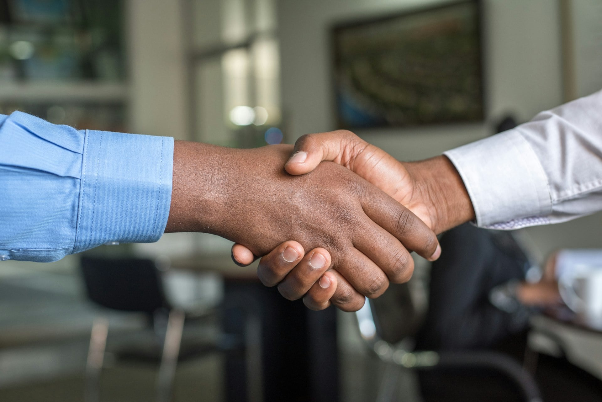 Professional handshake — start a sourcing conversation